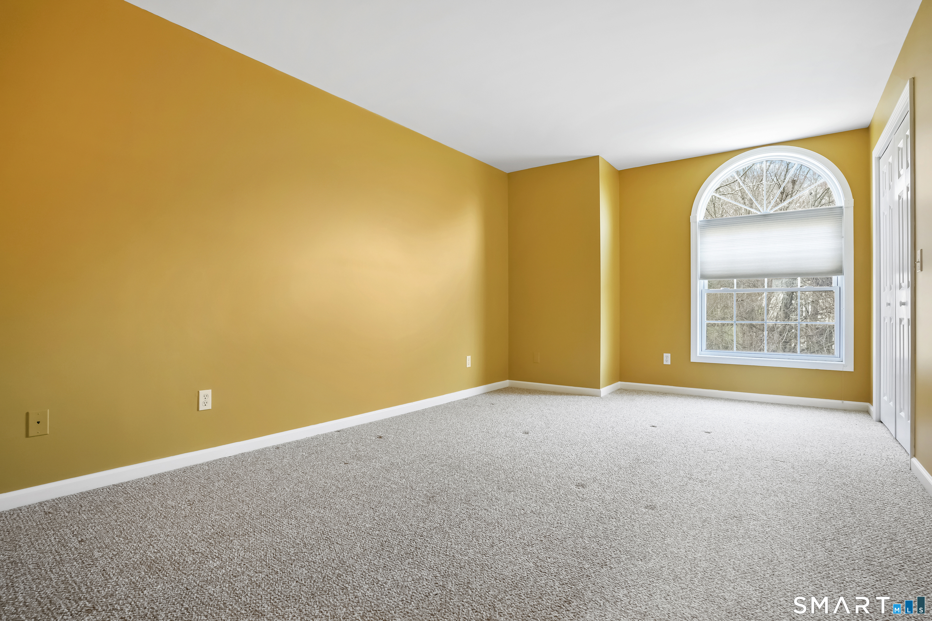 72 Perry Hill Road Shelton, CT 06484 - Photo 27 of 36 a view of an empty room with a window