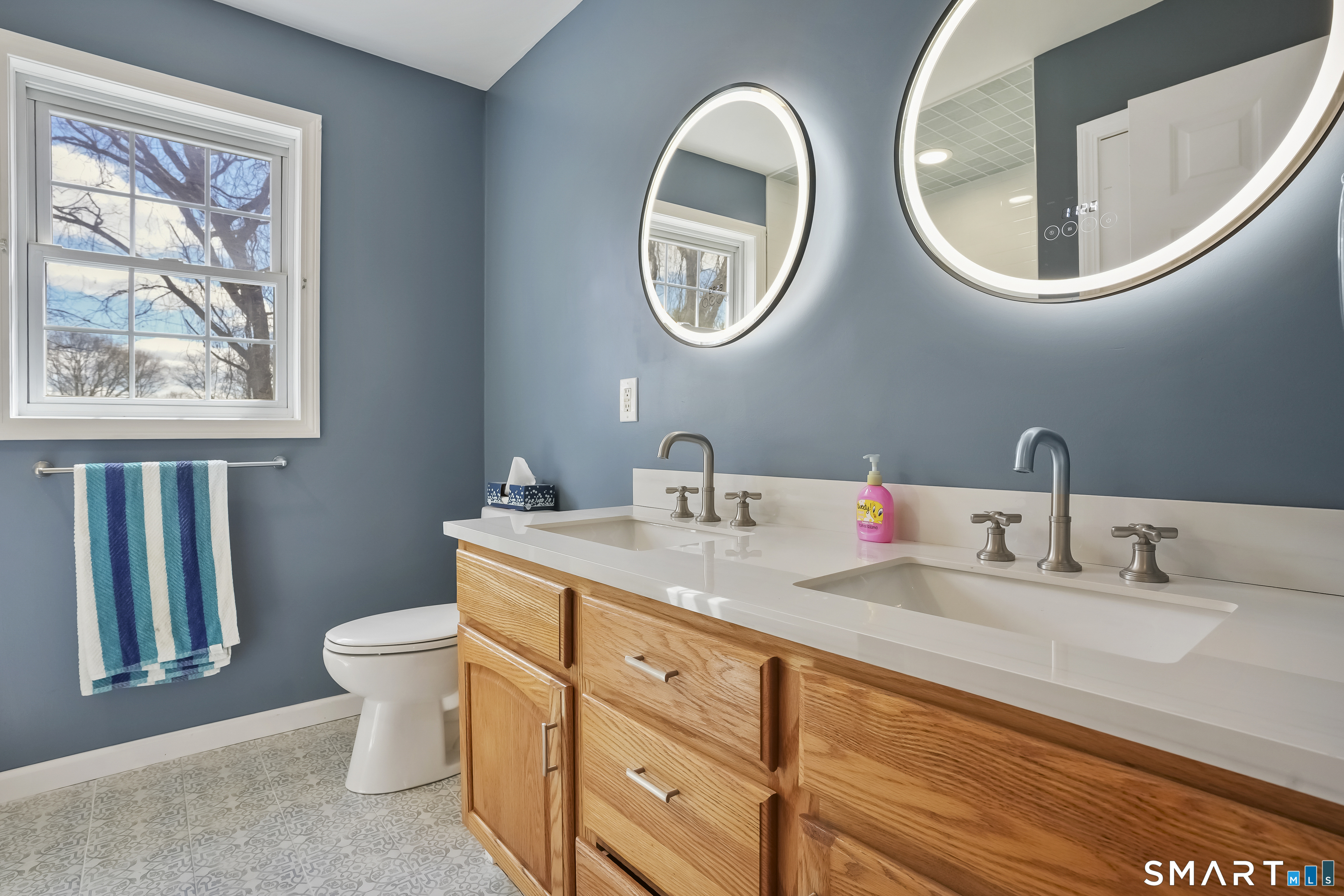 72 Perry Hill Road Shelton, CT 06484 - Photo 29 of 36 a bathroom with a toilet a sink and a mirror