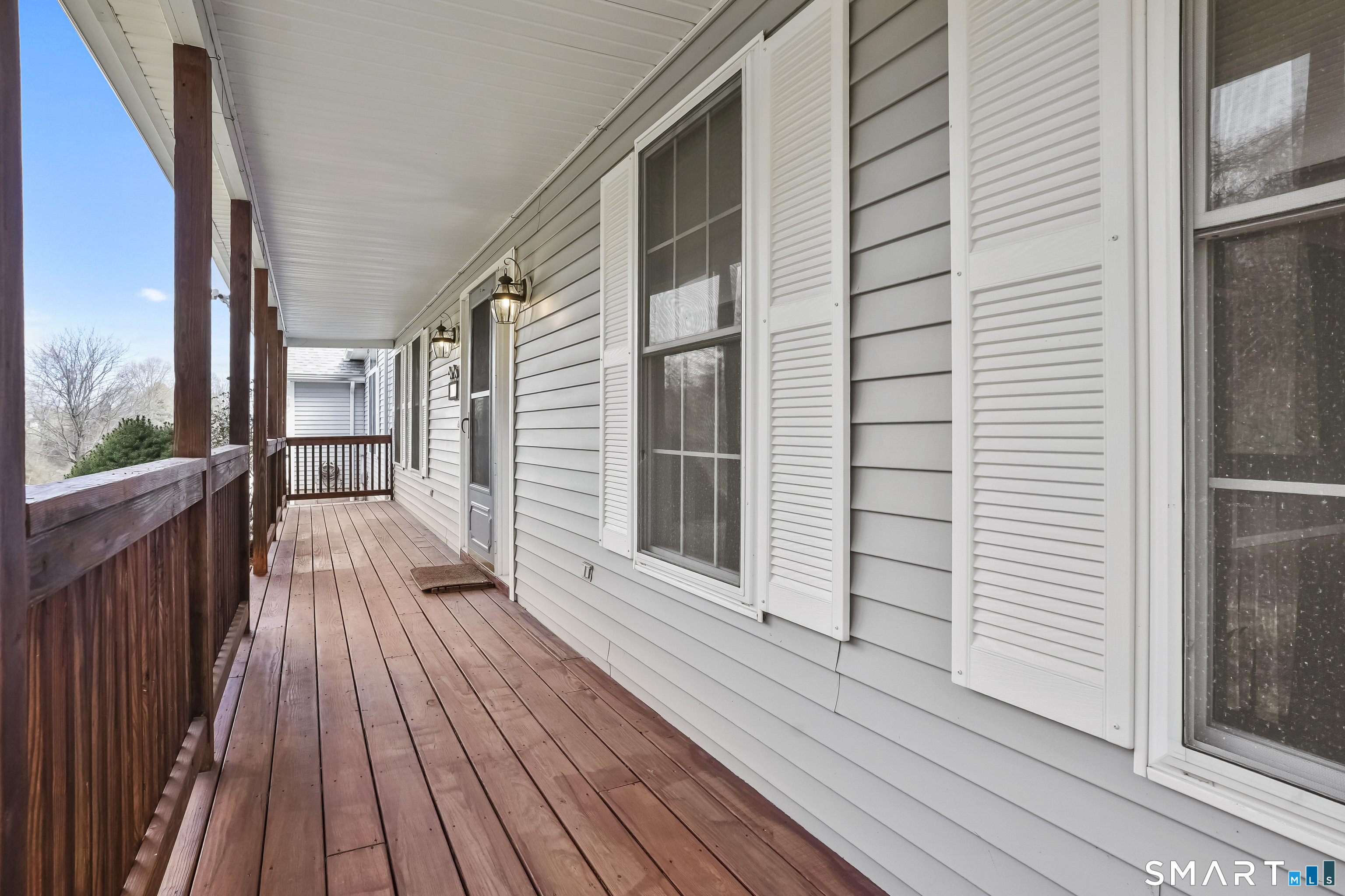 72 Perry Hill Road Shelton, CT 06484 - Photo 3 of 36 a view of a balcony with wooden floor