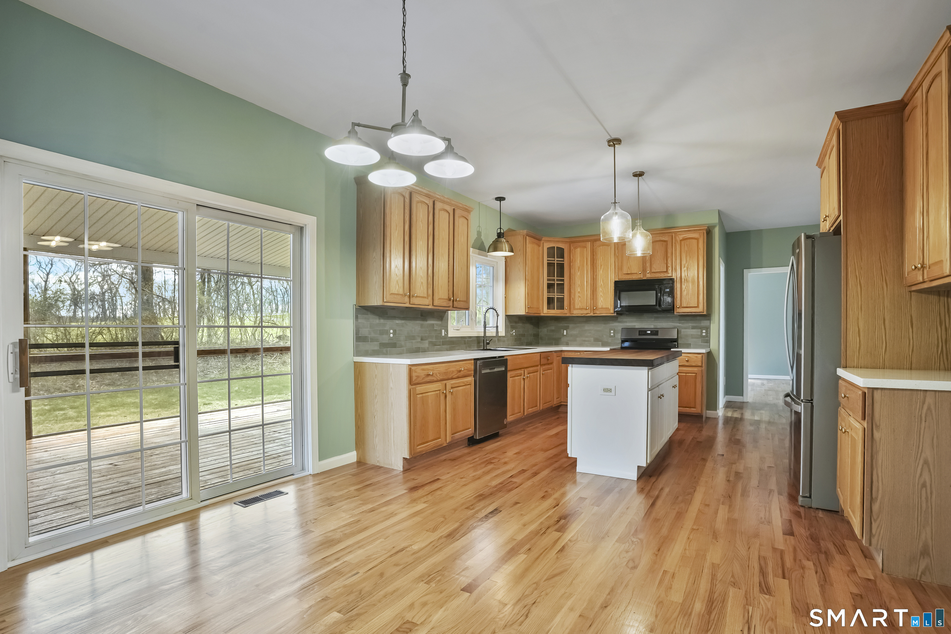 72 Perry Hill Road Shelton, CT 06484 - Photo 5 of 36 a large kitchen with stainless steel appliances lots of counter space and wooden floor