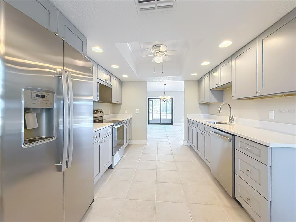 11603 West Bayshore Drive, Unit 118 Crystal River, FL 34429 - Photo 25 of 73 a large kitchen with stainless steel appliances lots of counter space and a sink
