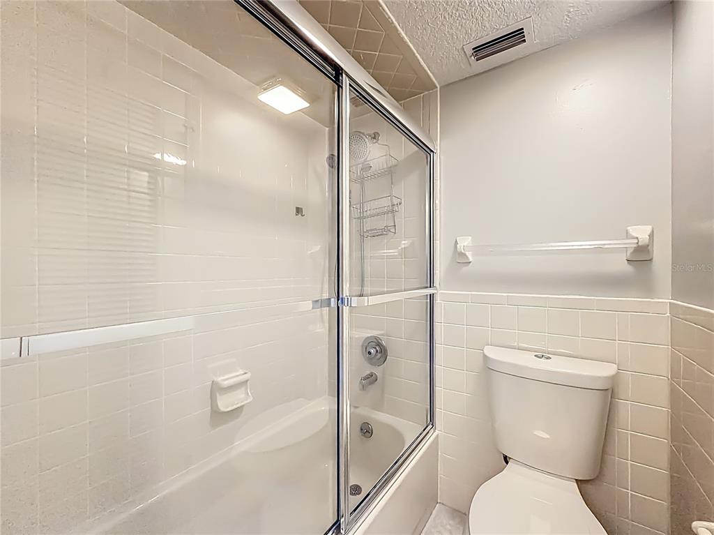 11603 West Bayshore Drive, Unit 118 Crystal River, FL 34429 - Photo 35 of 73 a bathroom with a toilet and a shower