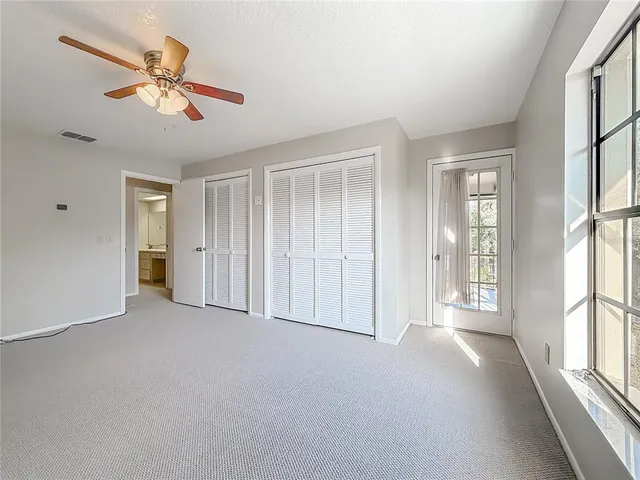 a view of a house with pool and chairs