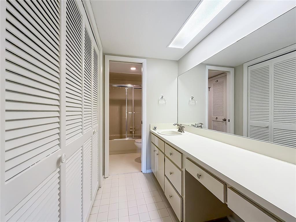 11603 West Bayshore Drive, Unit 118 Crystal River, FL 34429 - Photo 41 of 73 a bathroom with a sink and a mirror