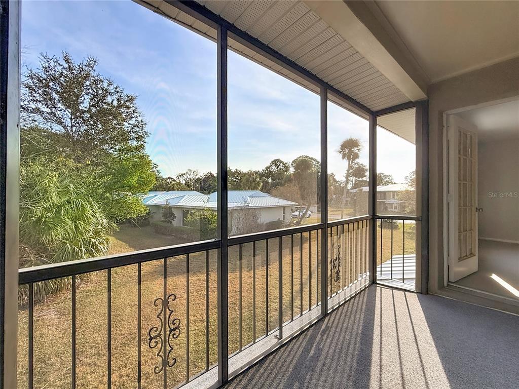 11603 West Bayshore Drive, Unit 118 Crystal River, FL 34429 - Photo 46 of 73 a view of a balcony with wooden floor