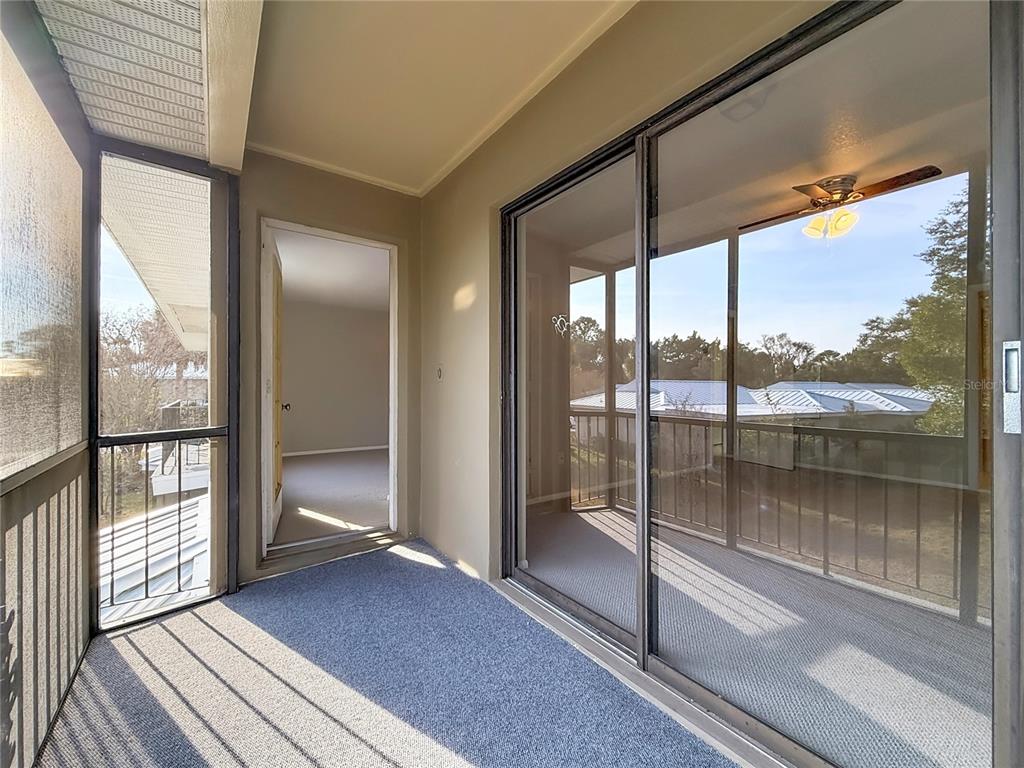 11603 West Bayshore Drive, Unit 118 Crystal River, FL 34429 - Photo 47 of 73 a view of a balcony with wooden floor