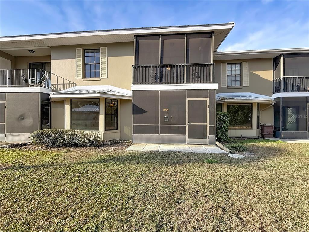 11603 West Bayshore Drive, Unit 118 Crystal River, FL 34429 - Photo 50 of 73 a front view of a house with a garden