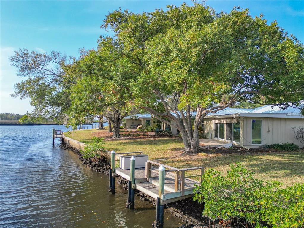 11603 West Bayshore Drive, Unit 118 Crystal River, FL 34429 - Photo 58 of 73 a view of a house with pool and sitting area