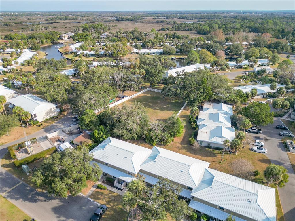 11603 West Bayshore Drive, Unit 118 Crystal River, FL 34429 - Photo 6 of 73 an aerial view of a house with a yard