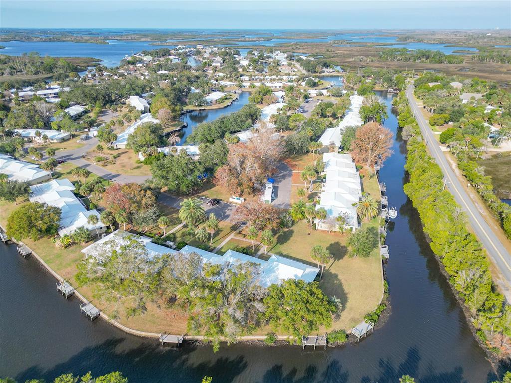 11603 West Bayshore Drive, Unit 118 Crystal River, FL 34429 - Photo 69 of 73 an aerial view of residential houses with outdoor space