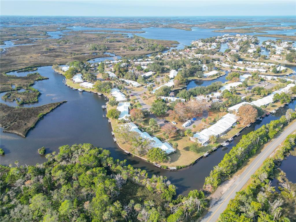 11603 West Bayshore Drive, Unit 118 Crystal River, FL 34429 - Photo 72 of 73 an aerial view of a house with a lake view