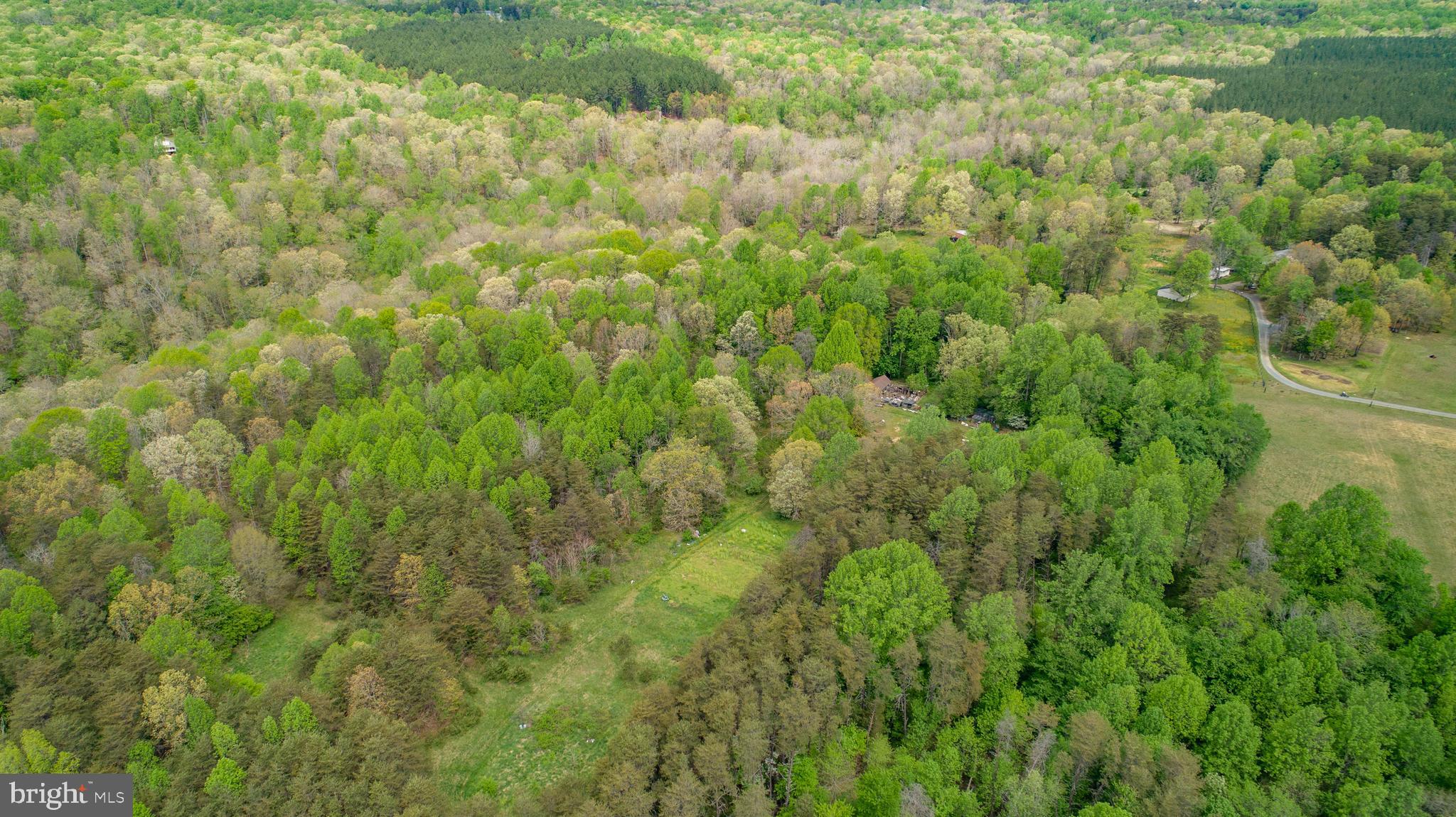 13520 Sillamon Road Goldvein, VA 22720 - Photo 21 of 22 Aerial view of open field on left side of home..