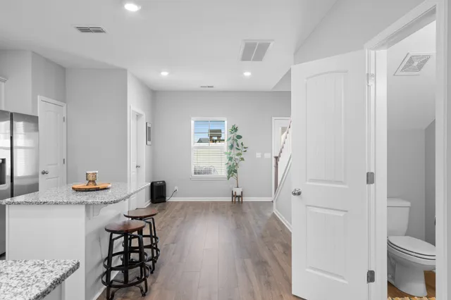 a view of kitchen with furniture and wooden floor