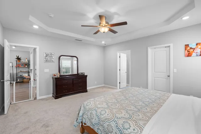 a bedroom with a bed and a dresser