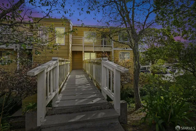 a view of a pathway with a building in the background