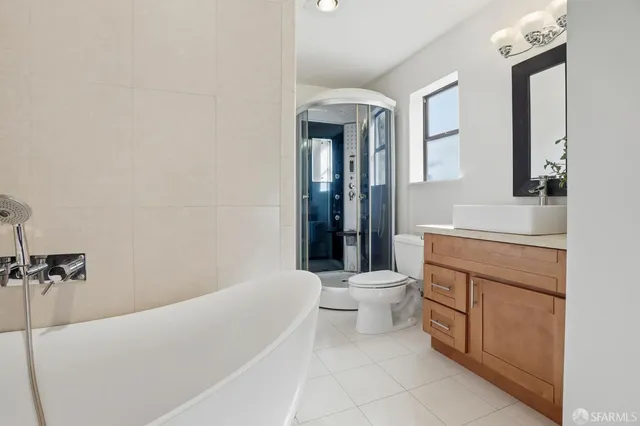 a bathroom with a shower and toilet