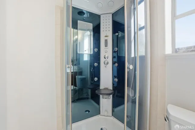 a view of a bathroom with a sink and mirror