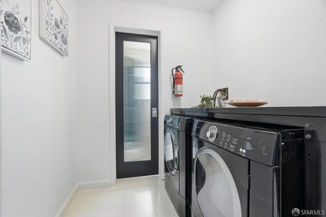 a view of a chair and tables in the balcony