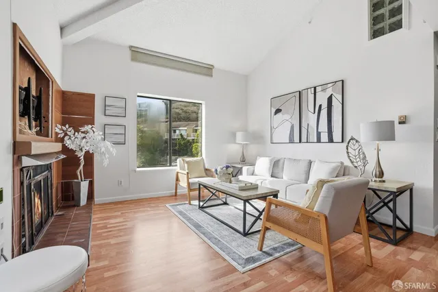 a living room with furniture and a table