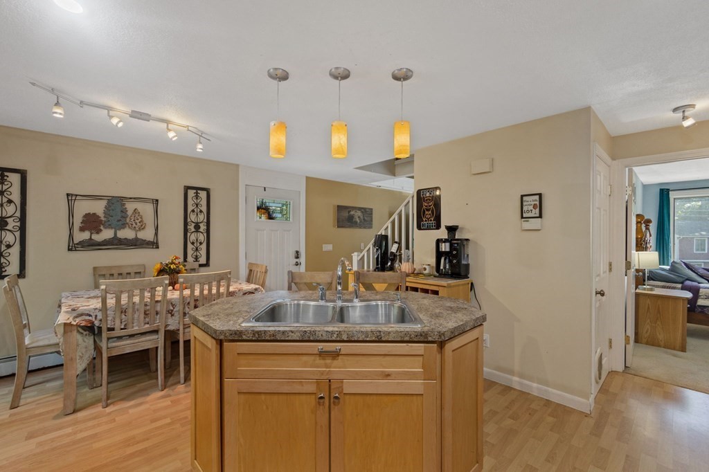 70 Colvintown Road Coventry, RI 02816 - Photo 8 of 41 a view of living room with kitchen island furniture and wooden floor