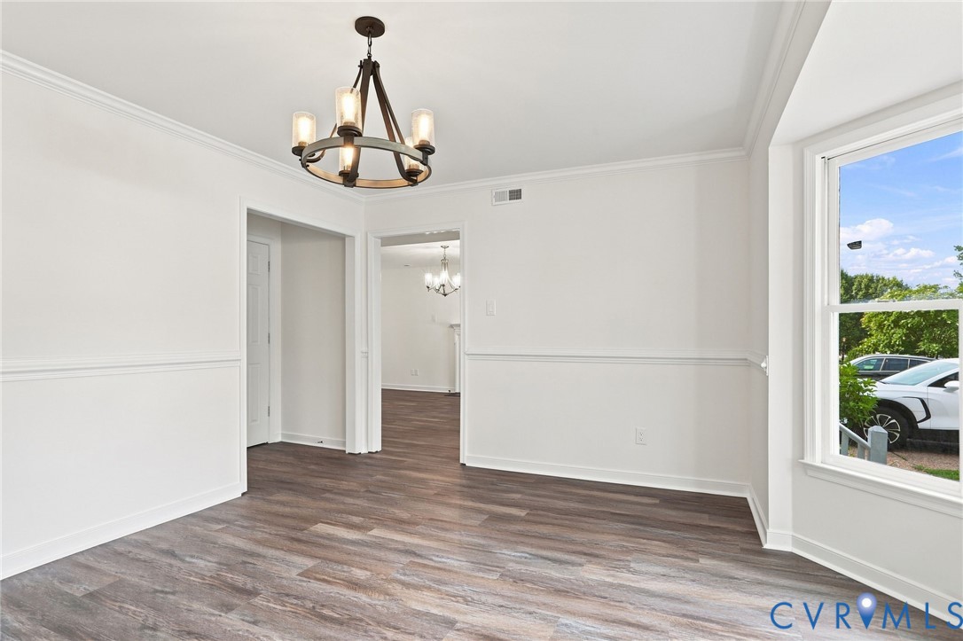 2549 Retrievers Ridge Road Henrico, VA 23233 - Photo 7 of 47 Wood-finish flooring, white paneled walls, crown m