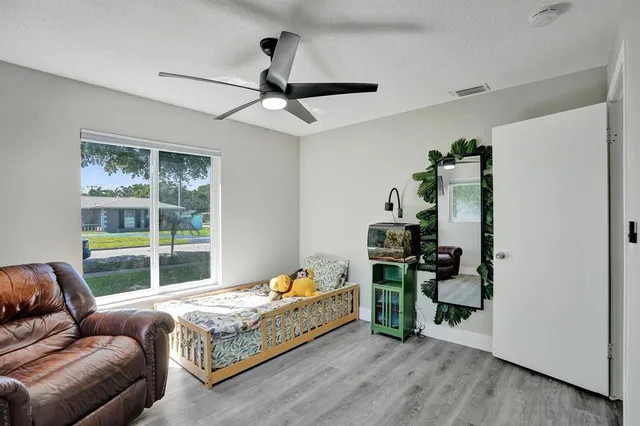 a bed room with a bed and a window