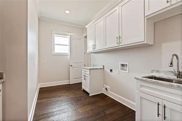 a view of hallway with wooden floor