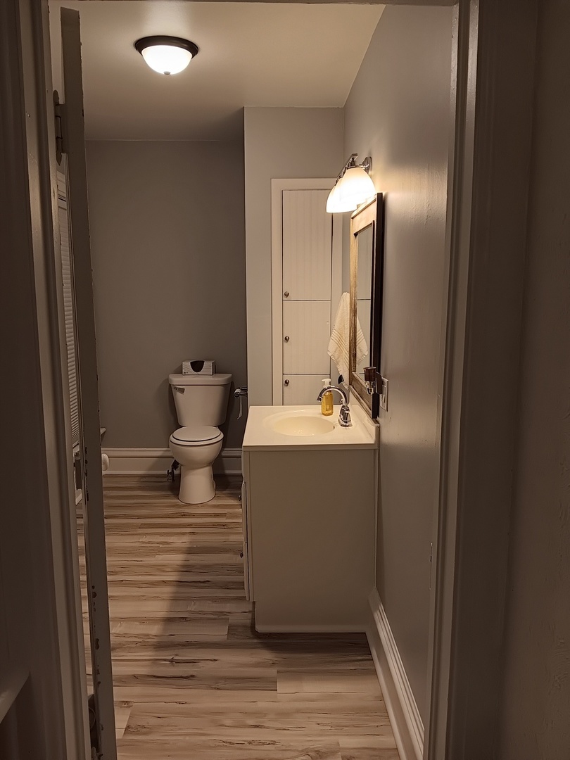 509 South Madison Street Morrison, IL 61270 - Photo 22 of 43 a bathroom with a sink and mirror