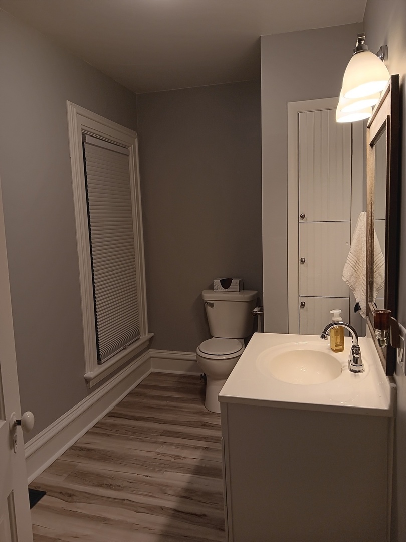 509 South Madison Street Morrison, IL 61270 - Photo 23 of 43 a bathroom with a sink and a mirror