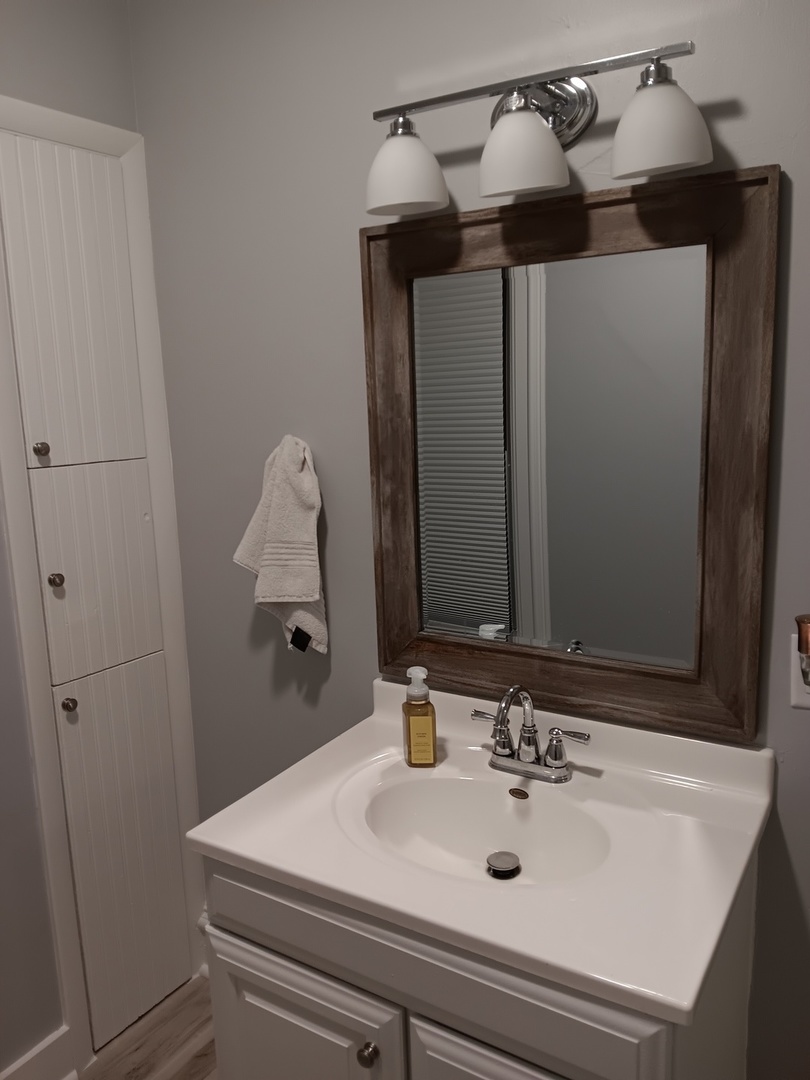 509 South Madison Street Morrison, IL 61270 - Photo 25 of 43 a bathroom with a sink and mirror