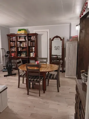 a kitchen with refrigerator and cabinets
