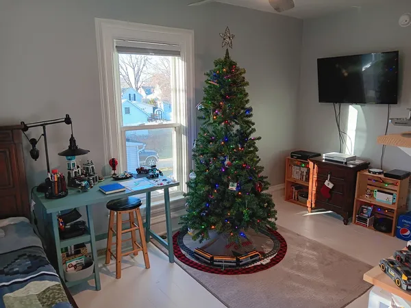 a living room with furniture potted plant and a window