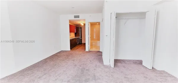 a view of livingroom with floor to ceiling window