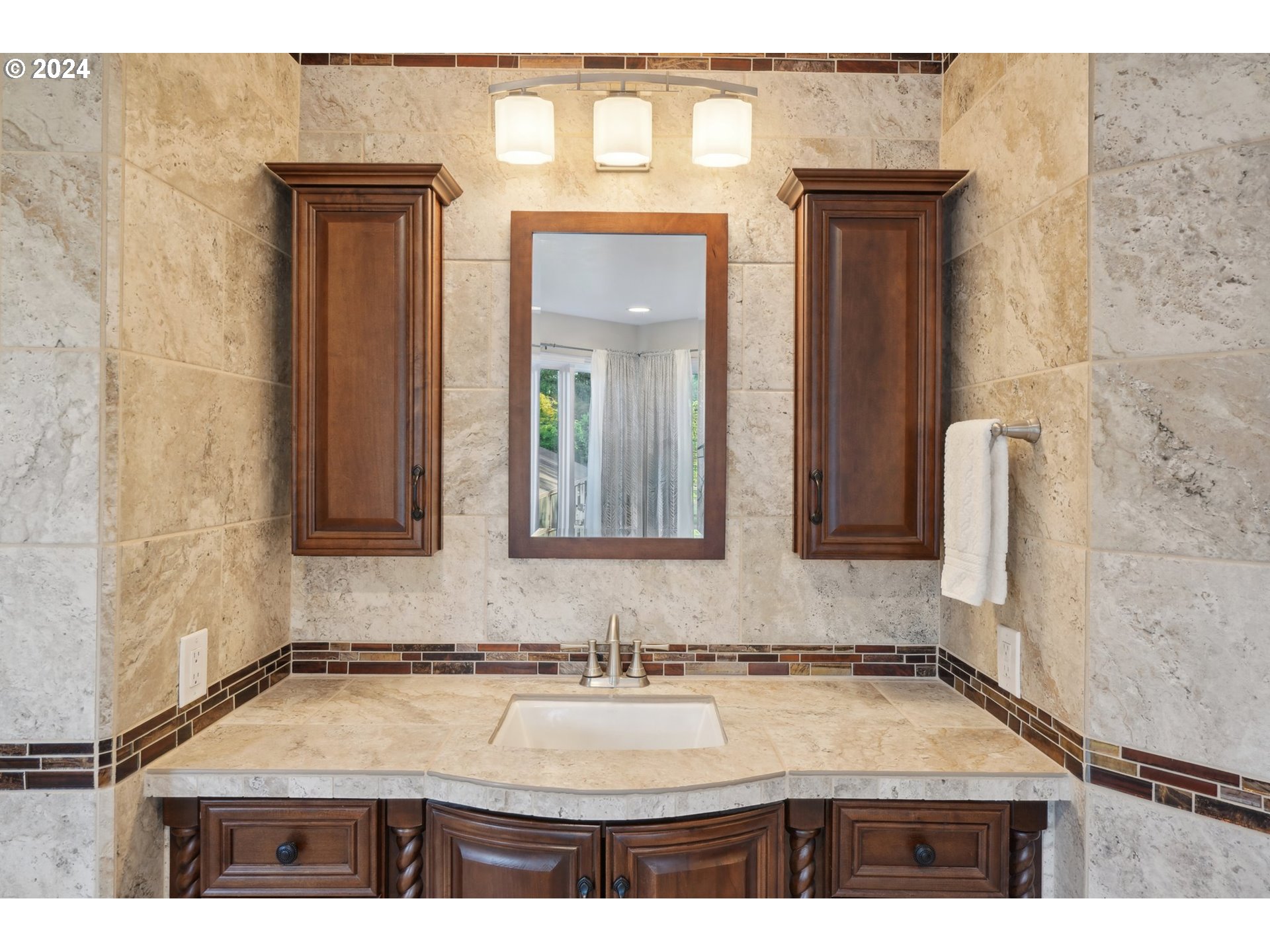 8121 Northeast 71st Loop Vancouver, WA 98662 - Photo 24 of 44 a bathroom with a granite countertop sink and a mirror