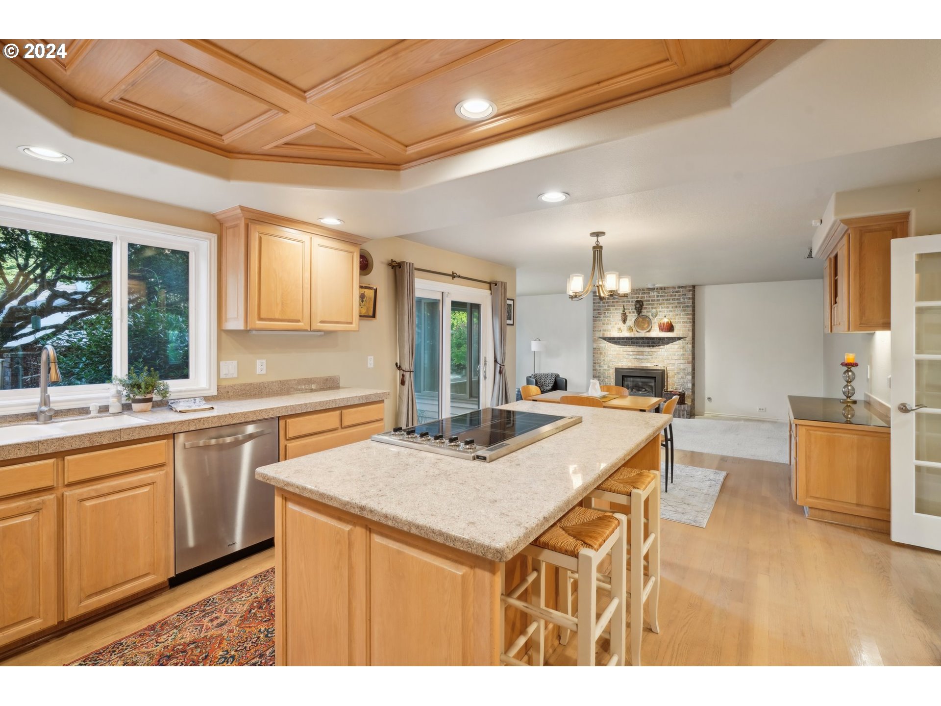 8121 Northeast 71st Loop Vancouver, WA 98662 - Photo 9 of 44 a kitchen with a sink a stove a refrigerator and white cabinets