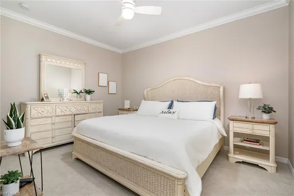 a bedroom with a bed and a lamp on table