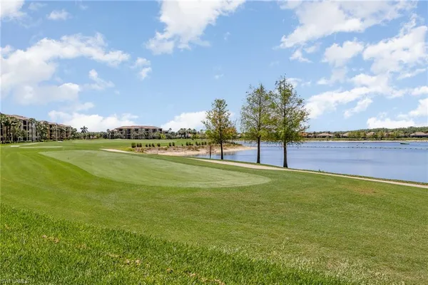 a view of a golf course with a lake