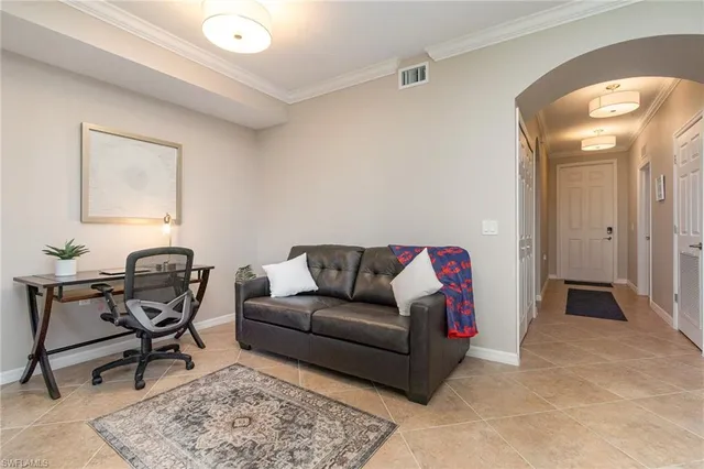a living room with furniture and a rug