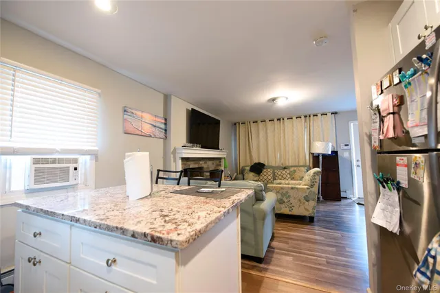 a living room with fireplace furniture and a flat screen tv