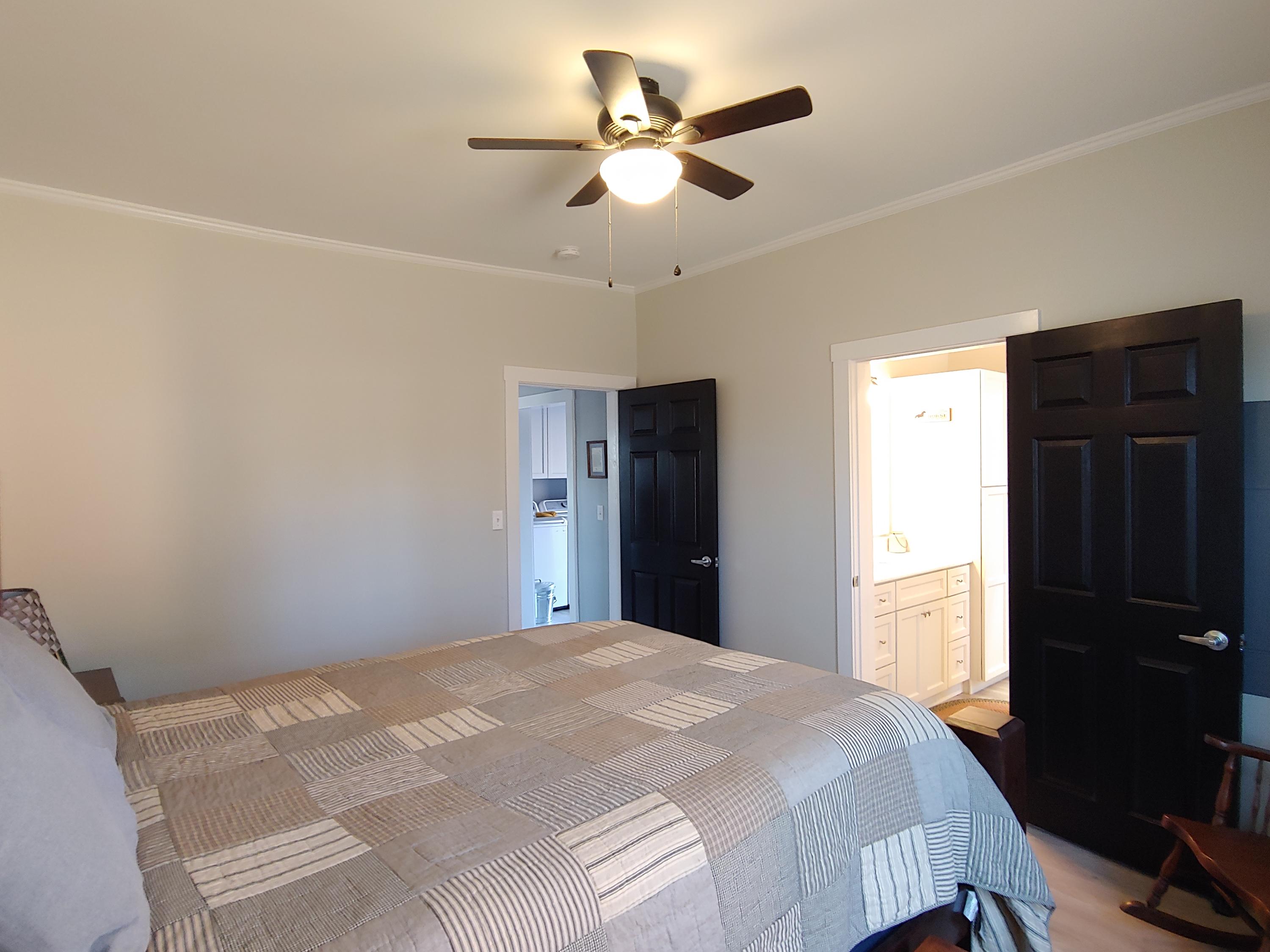1016 Lacks Town Road Clover, VA 24534 - Photo 20 of 30 a bedroom with a bed and a chandelier