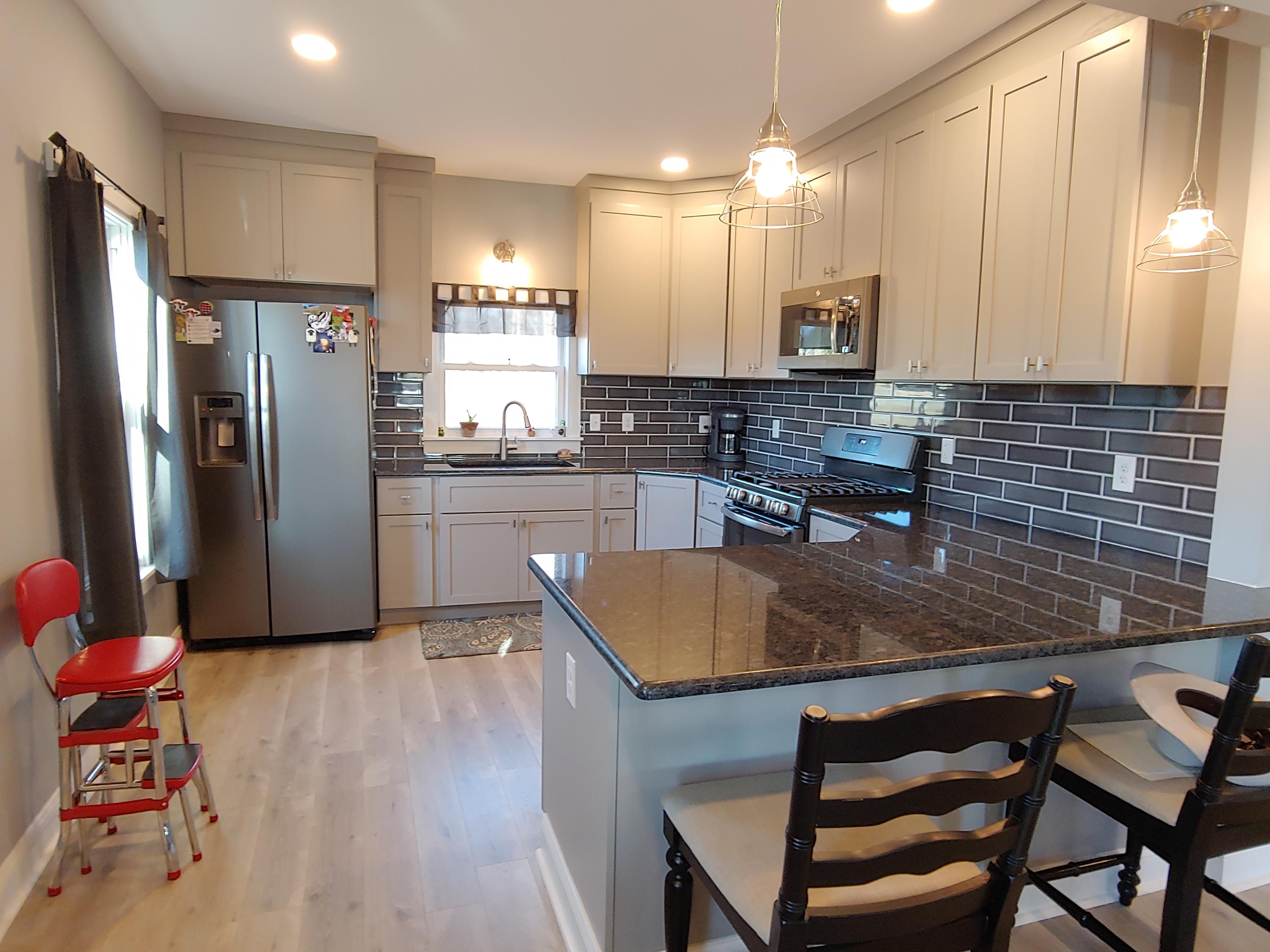 1016 Lacks Town Road Clover, VA 24534 - Photo 3 of 30 a kitchen with stainless steel appliances granite countertop a sink refrigerator and microwave
