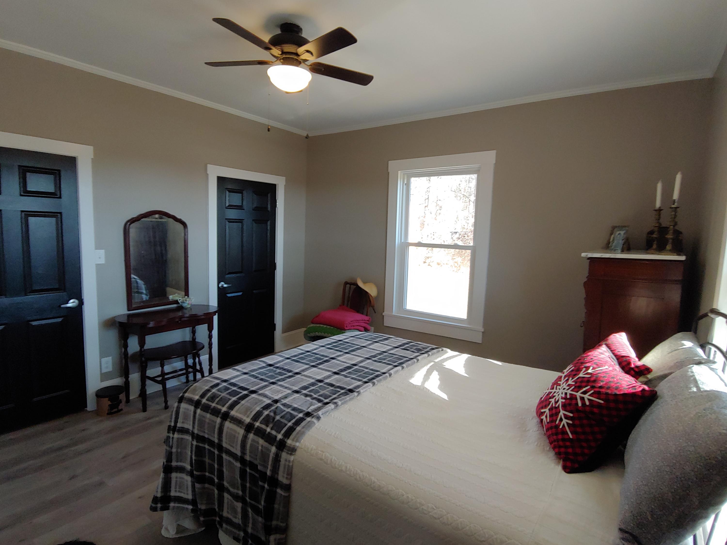 1016 Lacks Town Road Clover, VA 24534 - Photo 23 of 30 a bedroom with a bed and wooden floor