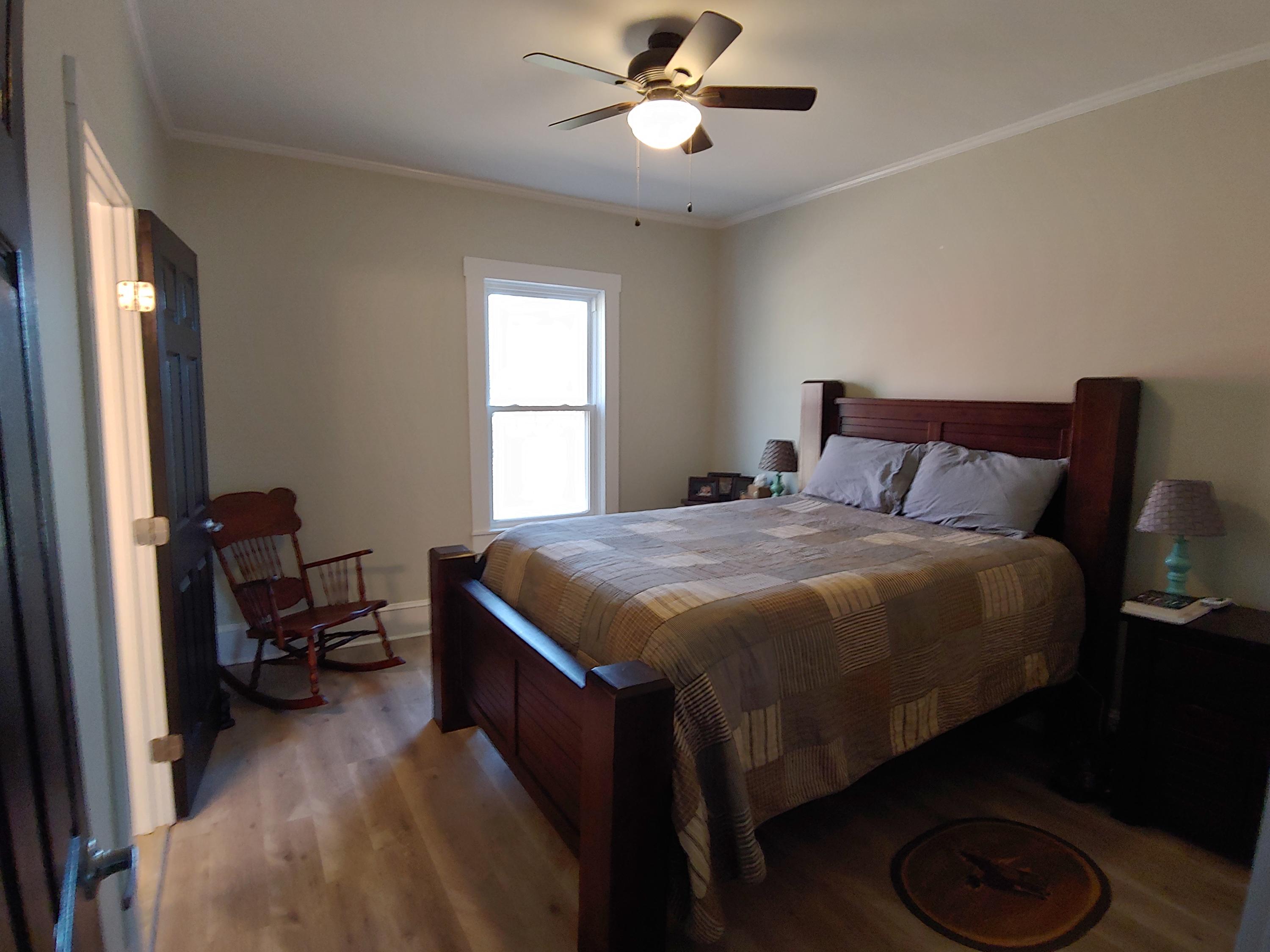 1016 Lacks Town Road Clover, VA 24534 - Photo 4 of 30 a bedroom with a bed and a chandelier