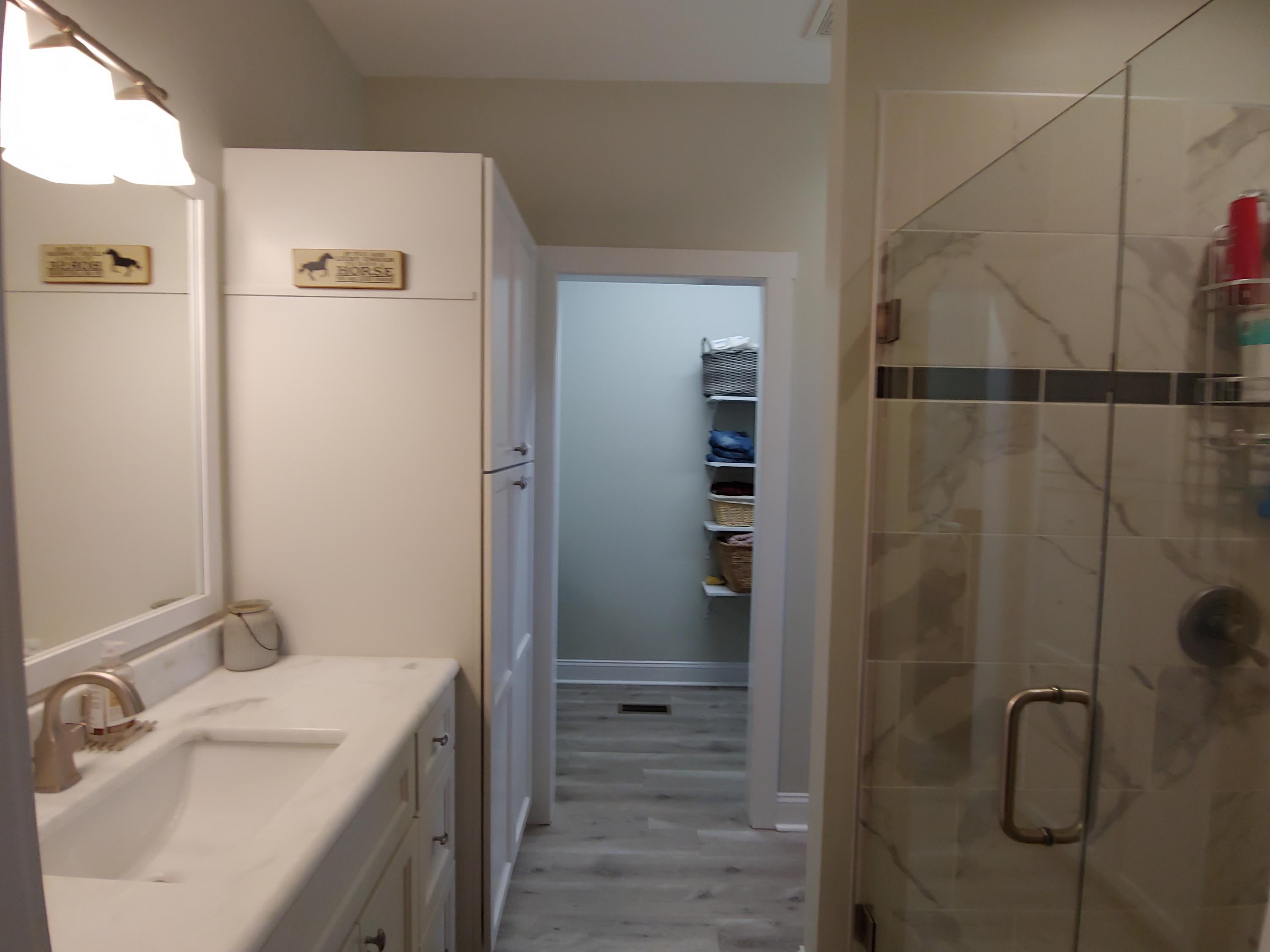 1016 Lacks Town Road Clover, VA 24534 - Photo 5 of 30 a bathroom with a shower sink and mirror