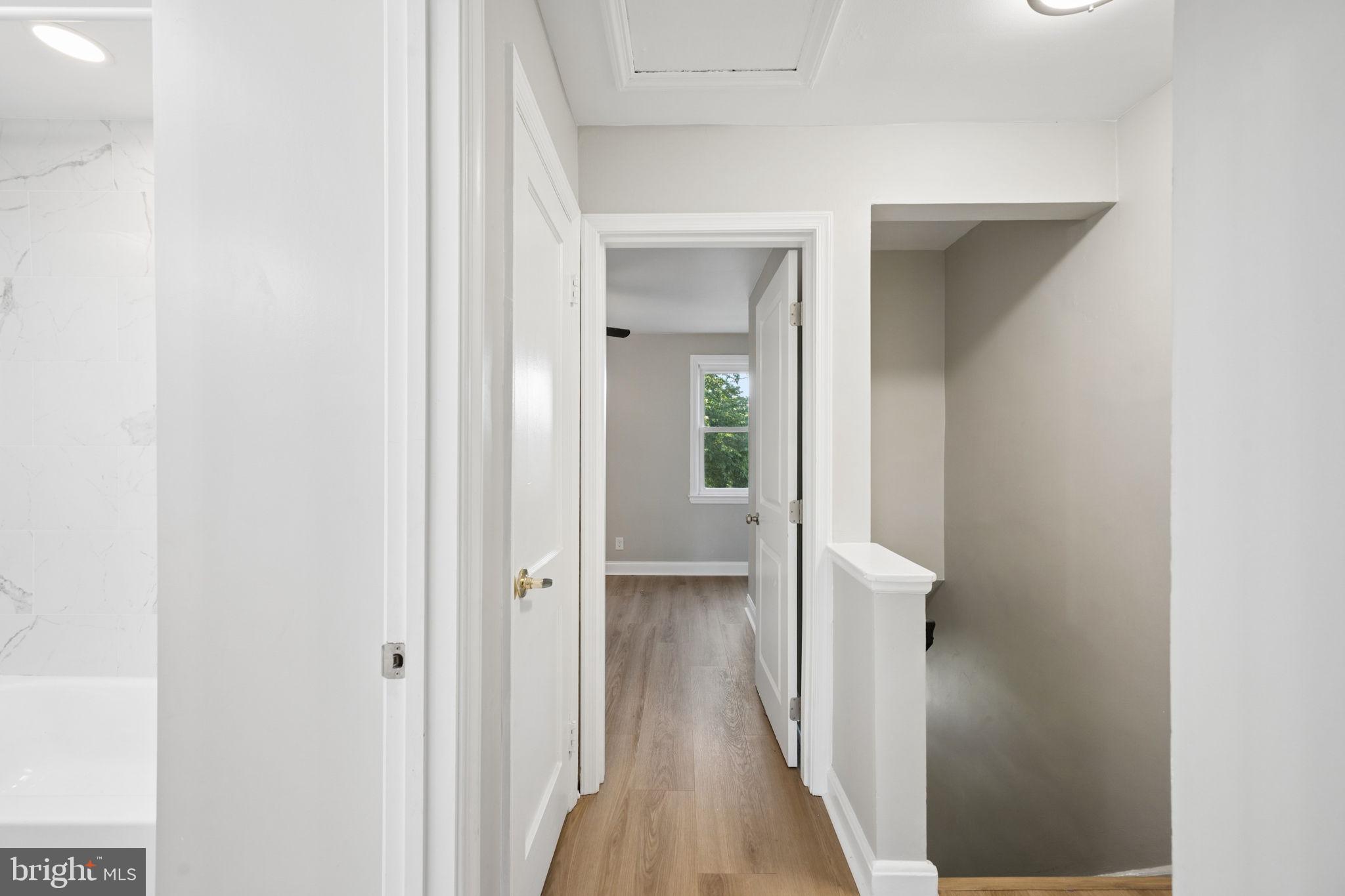3548 Benzinger Road Baltimore, MD 21229 - Photo 26 of 40 a view of a hallway with wooden floor