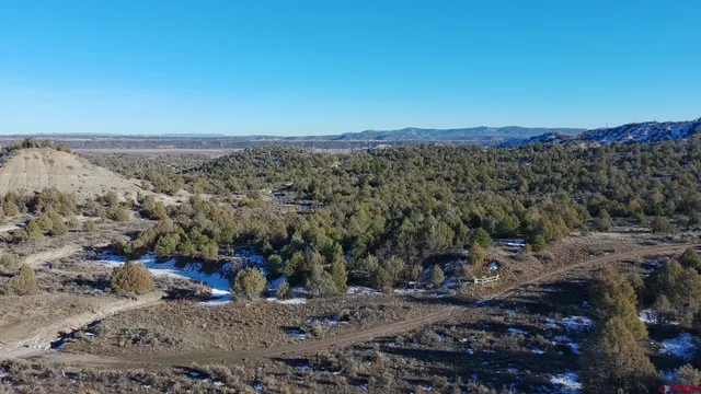 a view of a town with mountains in the background
