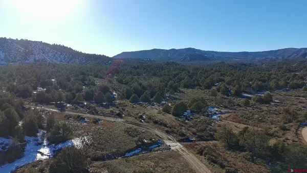 a view of a large mountains in a field