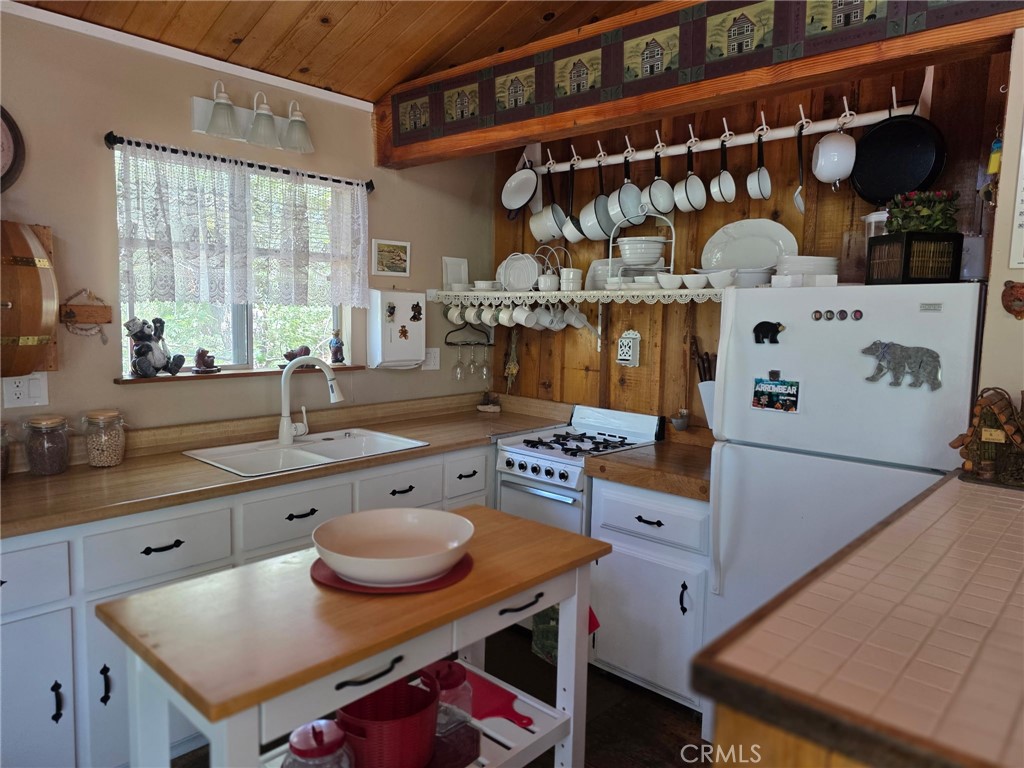 2151 Tank Road Running Springs, CA 92382 - Photo 11 of 29 a kitchen with a table and chairs in it