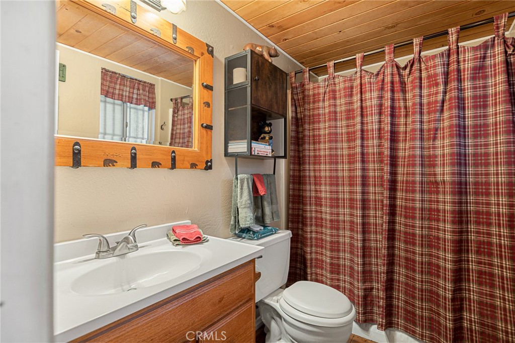 2151 Tank Road Running Springs, CA 92382 - Photo 15 of 29 a bathroom with a sink toilet and shower