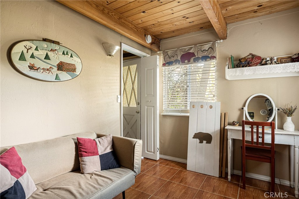 2151 Tank Road Running Springs, CA 92382 - Photo 21 of 29 a living room with furniture a window and a clock